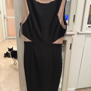 Black and tan extra small dress is very fitting and looks brand new style